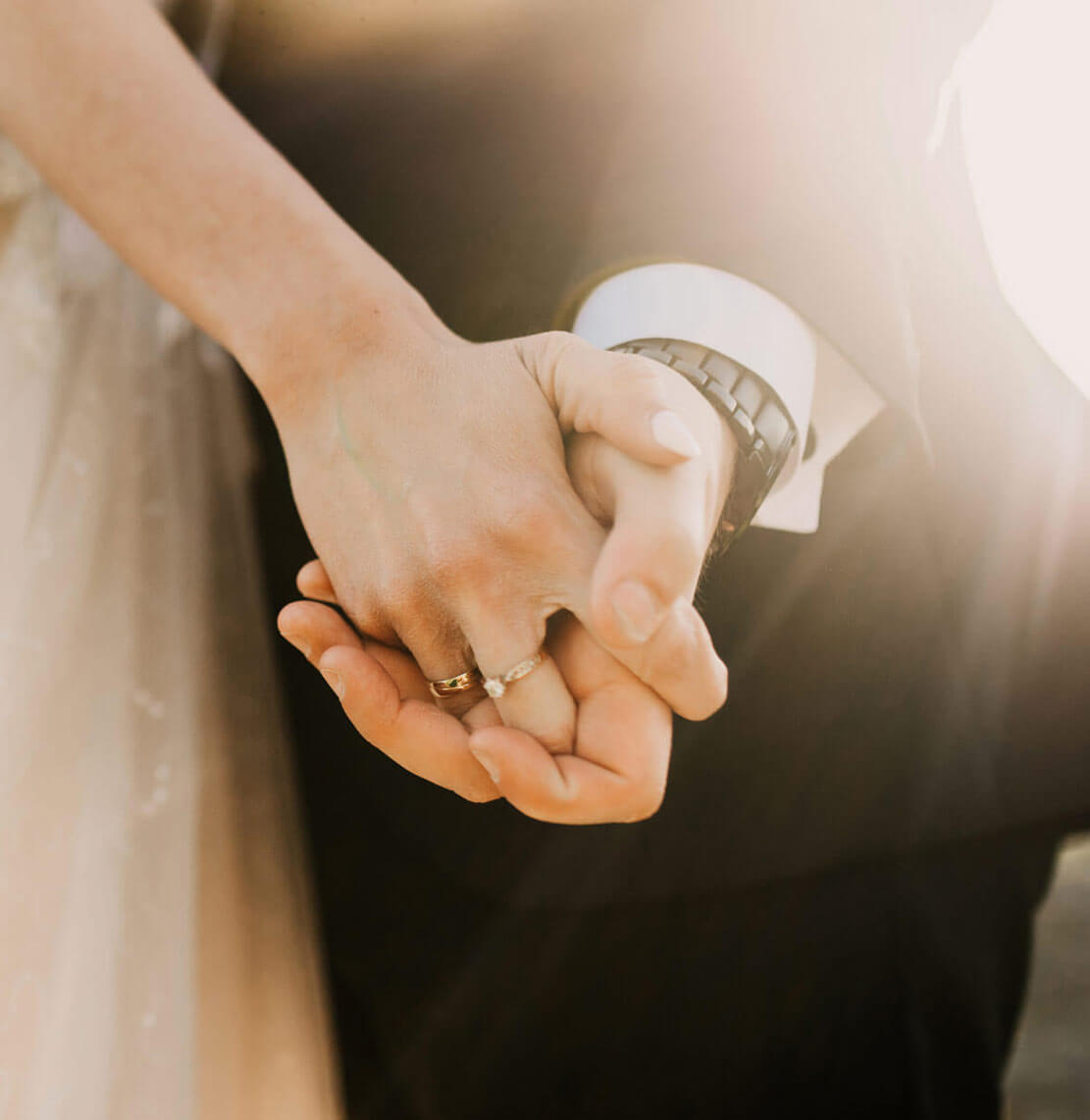 Newlyweds holding hands